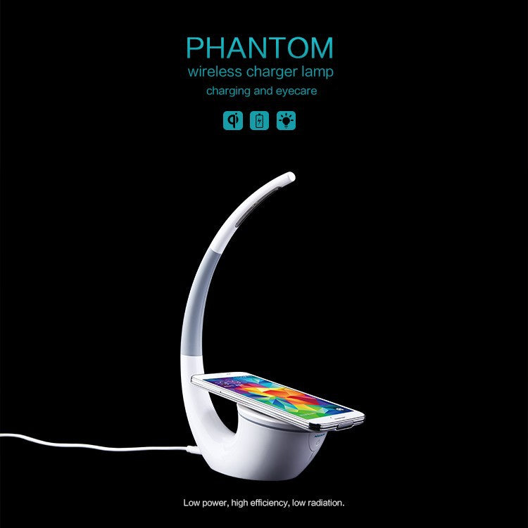 Wireless charger lamp with smartphone on a black background, labeled 'Phantom'.